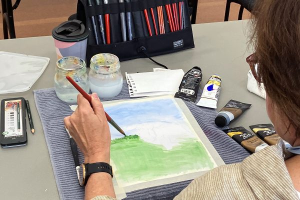 Participant painting watercolour landscape