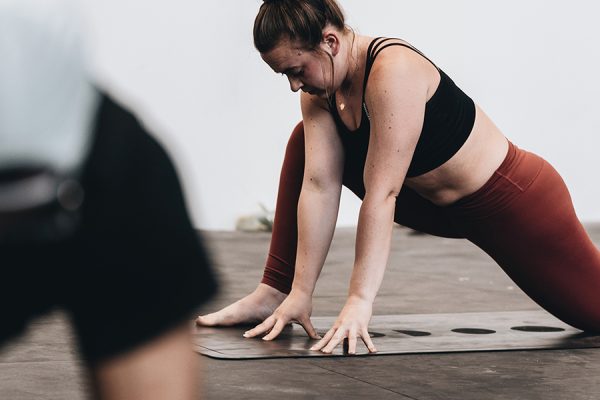 Woman participating in yoga class